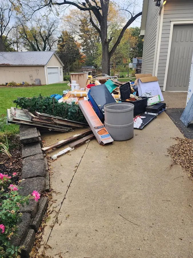 Dumpster being loaded with debris for Commercial Dumpster Rental in West End-Cobb Town